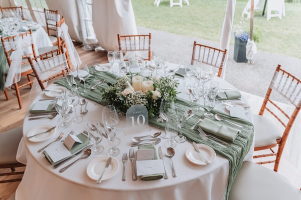 White chair covers on wedding chairs — Gulf Coast Wedding Event Rentals